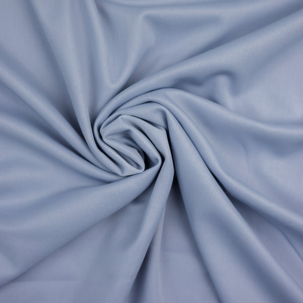 Világoskékes szürke, enyhén rugalmas szintetikus anyag, 140 cm széles